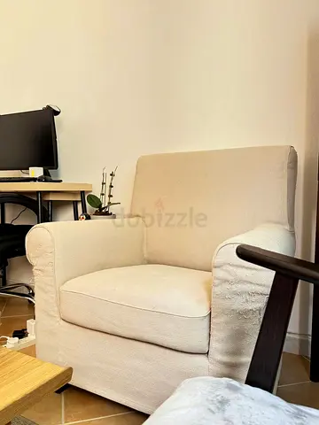 IKEA Beige slipcovered armchair with minor wear