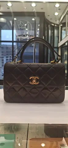 My black quilted leather handbag with gold CC logo
