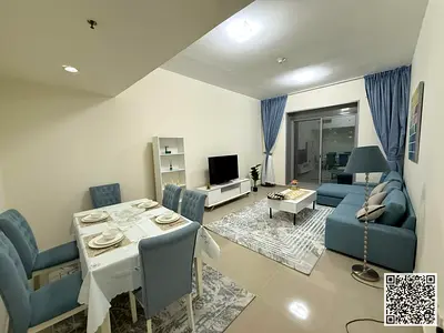 Luxury two-bedroom apartment with a living room, fully furnished with brand new, high-end furniture, and includes a private parking space within the t