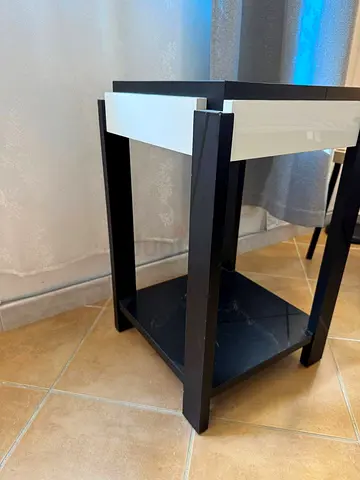 Compact black  white bedside table, used