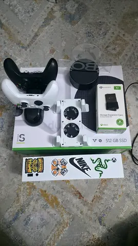 Xbox series s with 1tb storage and 3 controller and 1 dual fan cooler