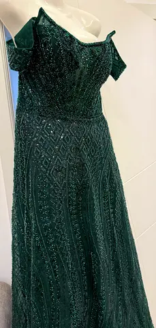 Emerald green beaded off-shoulder evening gown