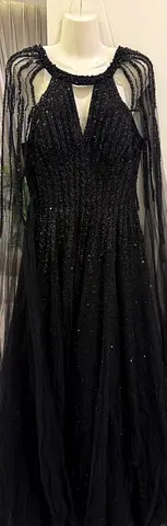 Black beaded evening gown with sheer embellished cape sleeves