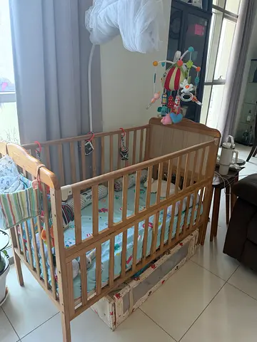Wooden Crib with Mobile and Bedding