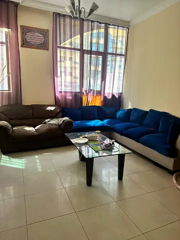 Comfortable Blue Sofa with Coffee Table