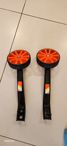 Orange bicycle support wheels. [FOR KIDS]