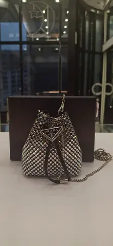 My silver crystal-studded mini bucket bag