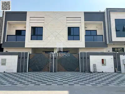 Luxury townhouse villa with a modern stone facade for sale in Al Bahia – Ajman. Freehold ownership | Bank financing or cash available.