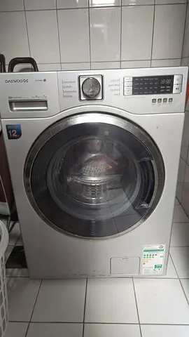 My silver front-load Daewoo washing machine - works well
