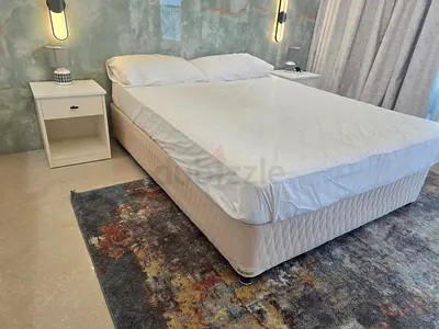 Elegant King Size Bed with Bedside Table