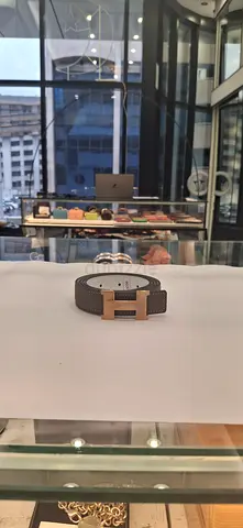 My brown leather belt with H‑style gold buckle — good condition