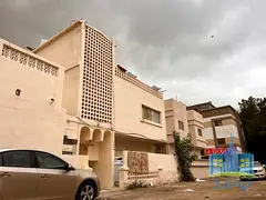 For sale: Spacious building with excellent income.