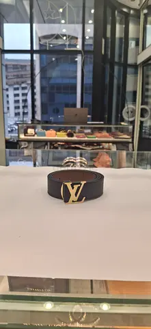 Louis Vuitton black leather belt with gold LV buckle - pre-owned