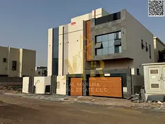 Luxury villa opposite the mosque in Al Yasmin, 5 master bedrooms, two floors, roof, and elevator-rea