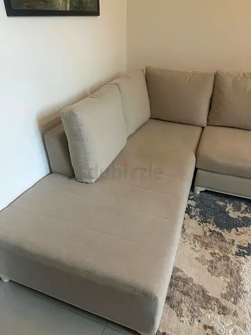 My beige L-shaped fabric sectional sofa - gently used