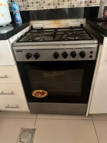 Used 4-burner gas stove and oven - needs cleaning