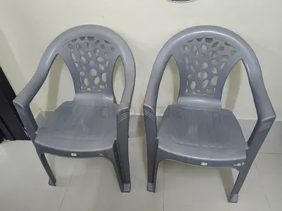 Two grey plastic patio chairs - never used and in excellent condition