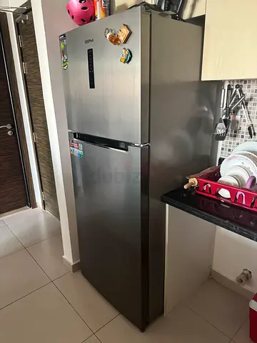 Stainless steel double-door refrigerator in good condition