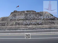 Two Adjacent Residential Plots for Sale in Masfout Basin 8 Ajman Corner on 3 Streets Plus Lane 9050