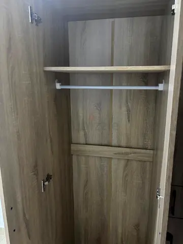 My single-door oak-finish wardrobe with hanging rail and shelf
