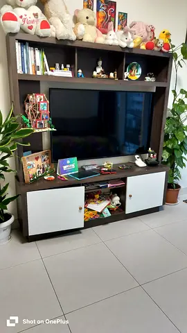 Dark wood entertainment unit / TV stand with shelves and cabinets.