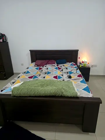 Queen size Dark wood bed  with 25 cm thick mattress. Its is perfect condition.