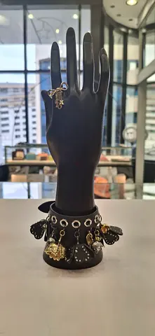 My gold-tone charm bracelet with assorted charms