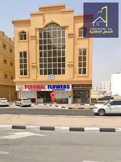 For sale: Muwailih commercial building on Jar Street 36, with an income exceeding 9%.