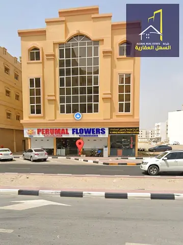 For sale: Muwailih commercial building on Jar Street 36, with an income exceeding 9%.