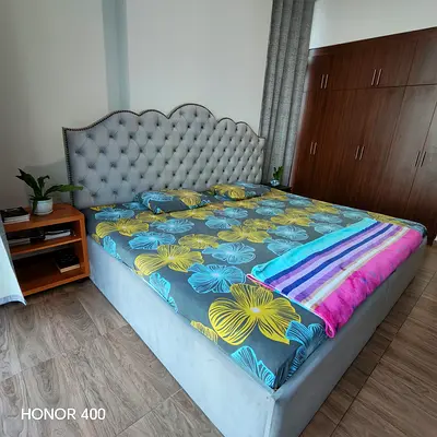 King-size upholstered bed with tufted headboard — good condition