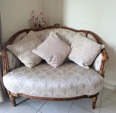 Elegant Vintage Sofa with Decorative Cushions with oval marble table