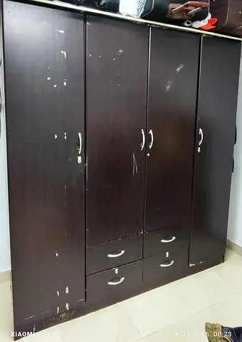 Dark brown 4-door wardrobe with drawers — used, sturdy storage