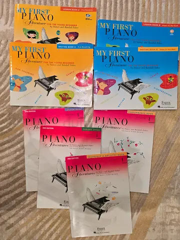 8 Piano Adventure books