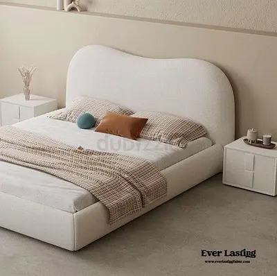 Cream Upholstered Bed with Curved Headboard