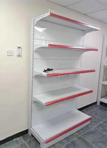 My used wall gondola shelving unit - 5 adjustable shelves