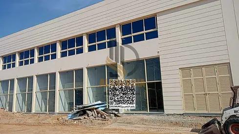 A strong investment opportunity located directly on a main road in Umm Al Thaoub New Industrial Area, one of the fastest-growing industrial and comme