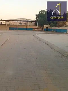 Enclosure located warehouse near Al Wahda Street and King Faisal Street, with offices and rooms