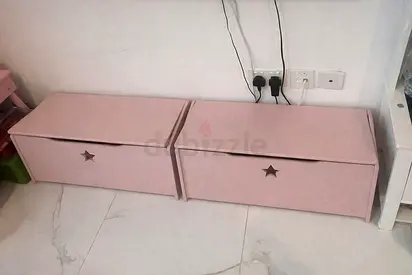 Pair of pink childrens storage drawers with star cutouts