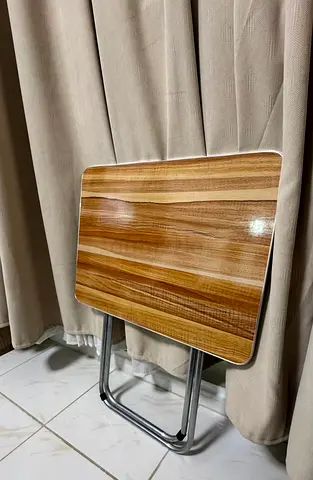 Compact foldable wooden table with chrome legs