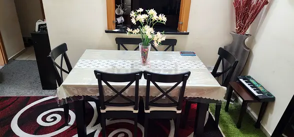 6-seater dark wood dining table set in good condition extendable