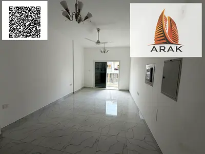 Two-bedroom apartment with a living room, two bathrooms, and a balcony for rent in Al Mowaihat 3. The apartment features new central air conditioning,
