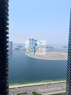 An apartment in Al Khan featuring a direct view of Al Khan Lake and another view of the Qasba Canal.