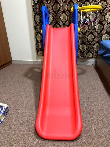 Kids playing slide plus basket ball