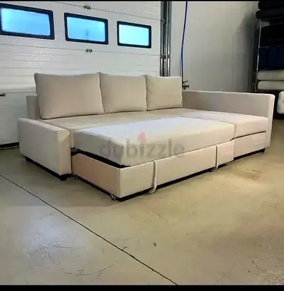 My beige L-shaped sofa bed — converts to large bed, good condition