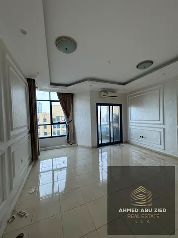 Two bedrooms and a living room for rent in Al Khor Towers with a direct view of the creek, a balcony, a maid's room, and three bathrooms. Prime locati