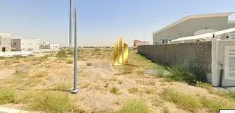 Residential land for sale in Sharjah, Al Tayy, east of Al Suyoh suburb, freehold ownership for Arab