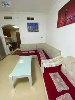 Furnished studio apartment in Al Yasmin Towers, with a good size, free parking, and a prime location