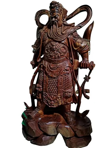This item is a decorative hand-carved wooden statue depicting Guan Yu (also known as Guan Gong), a r