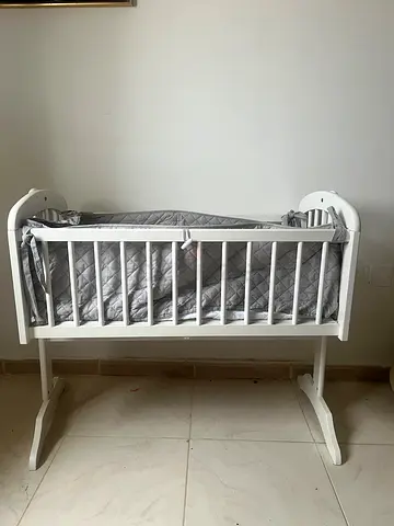 Elegant White Baby Crib with Soft Bedding