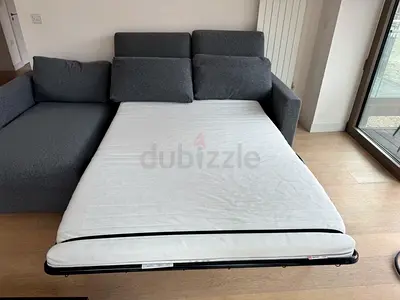 Gunnared dark L shape sofa bed with mattress